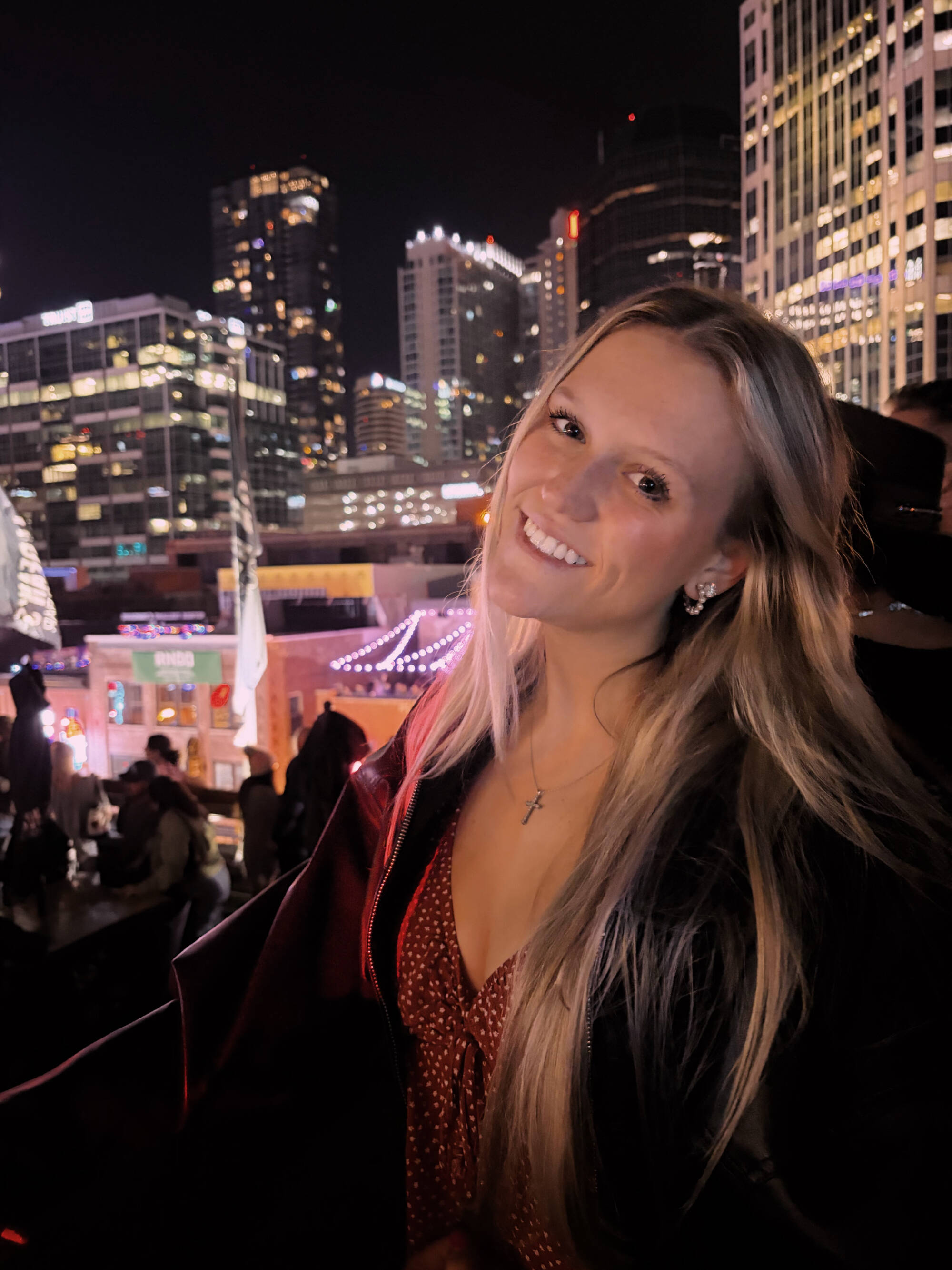 Caroline in front of a city